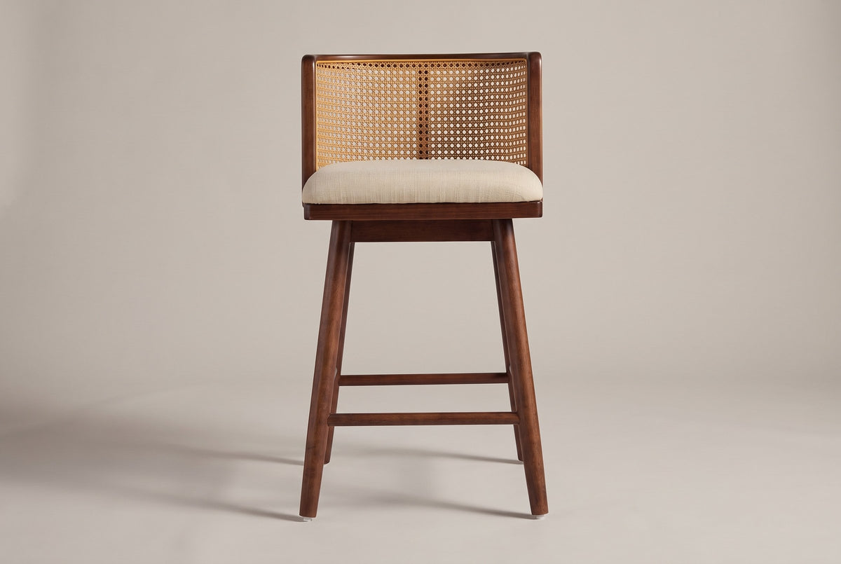 Rasiglia counter stool, straight front view: low wrap-around cane-look back with a centre strip, beige seat