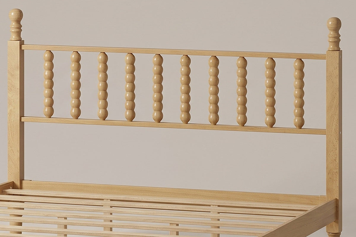 Close-up of the Ravenna headboard: ten turned bobbin spindles between two posts with ball finials