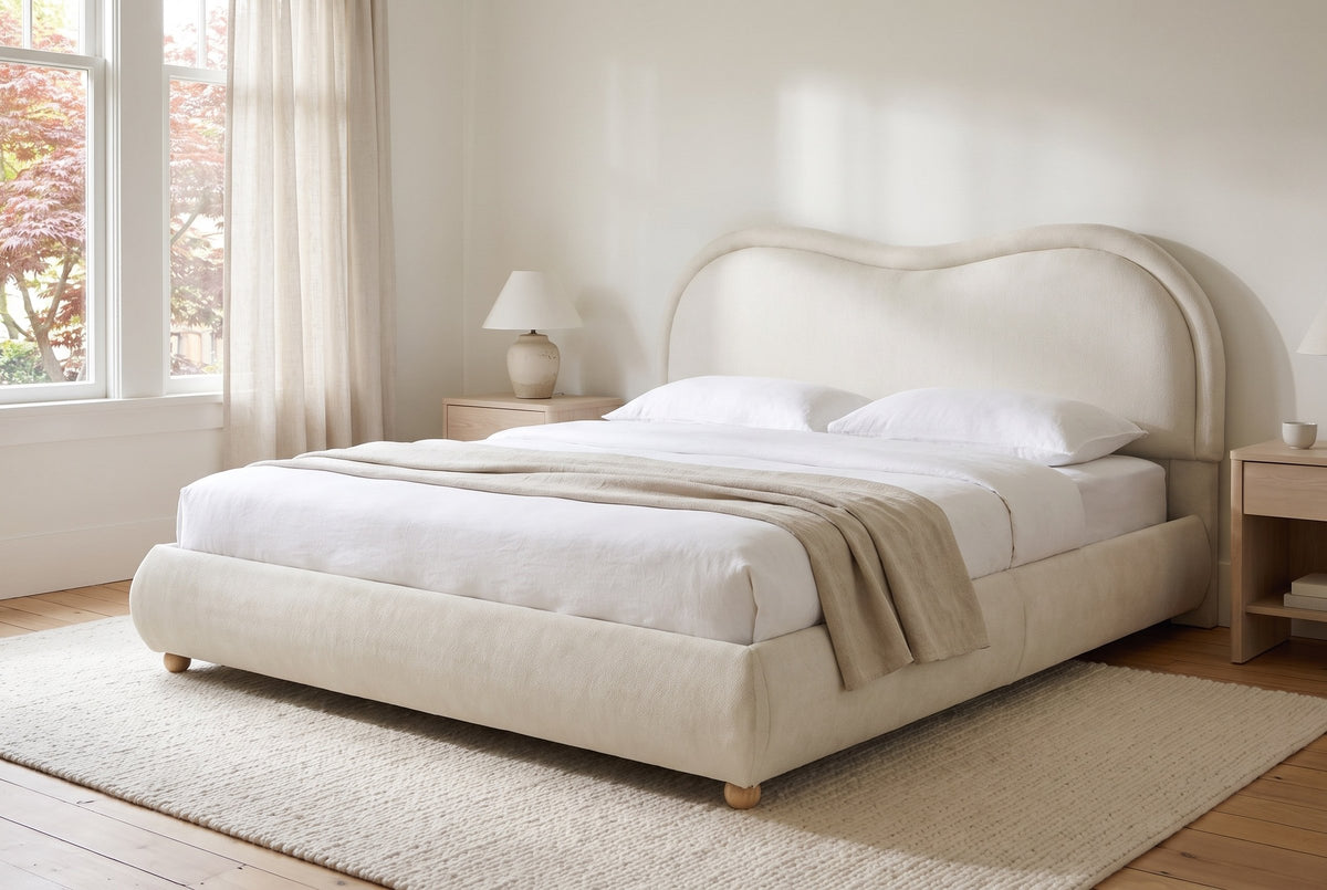 Recanati cloud bed made up with white linen in a bright Craftsman bedroom with sheer curtains and a red Japanese maple outsid