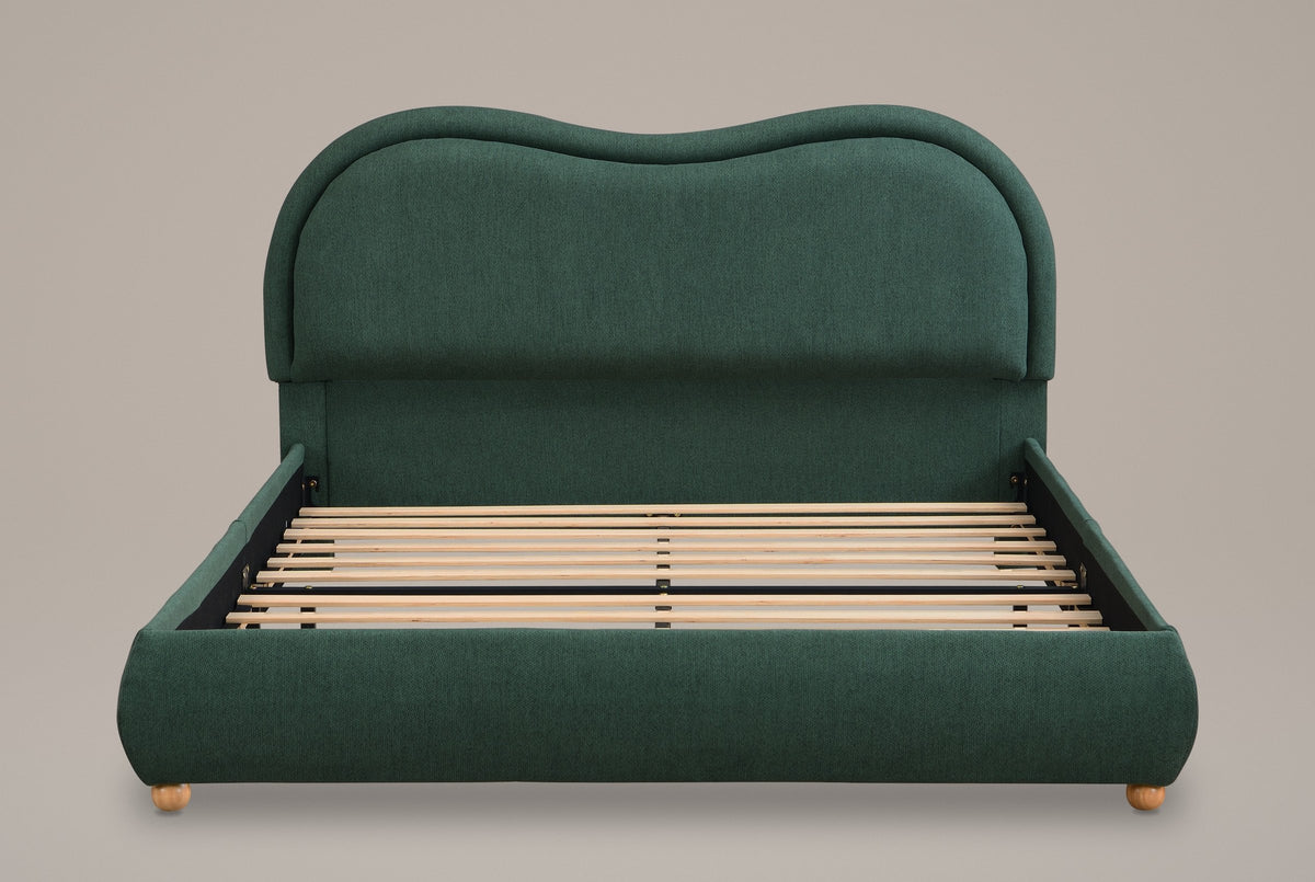 Recanati cloud bed in forest green chenille, straight front view: wavy headboard with a rolled border, rounded rails