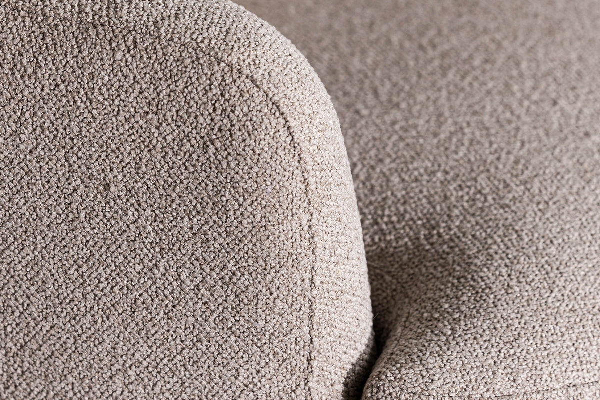 Close-up of the Ripatransone arm in Beige: the back rounding over into the arm in a soft, nubby textured fabric