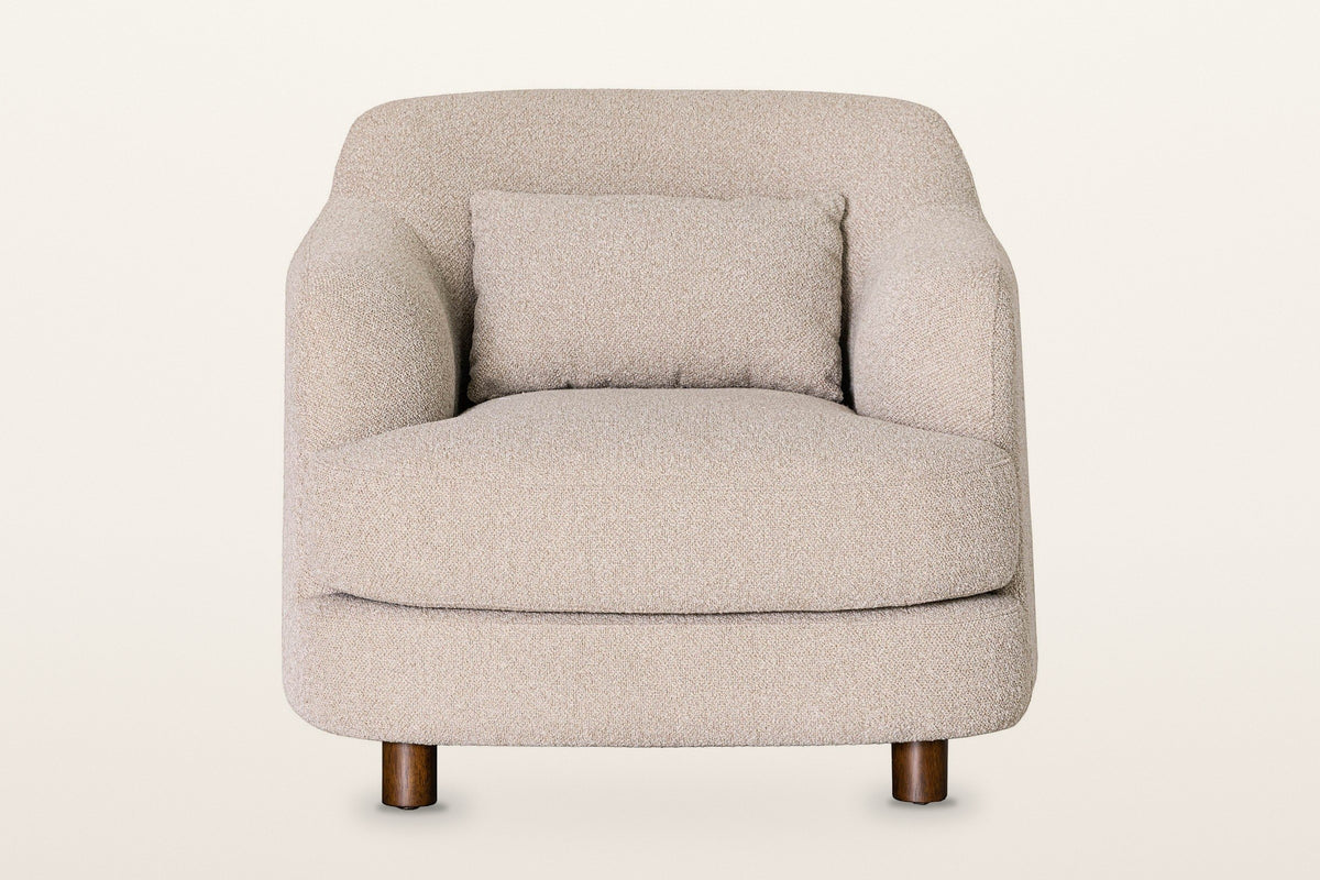Ripatransone accent chair in Beige, straight front view on a warm white studio backdrop: the curved back