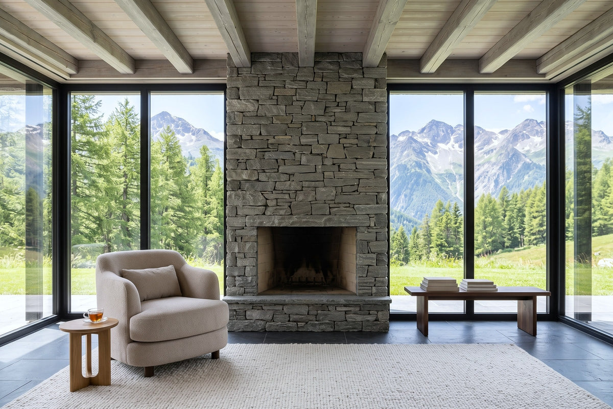 Ripatransone accent chair in Beige facing the camera in a Verbier chalet, beside a dry-stack stone fireplace