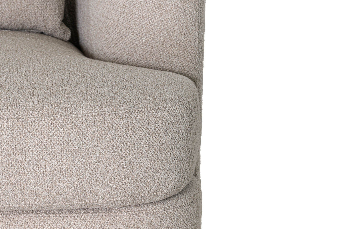 Close-up of the Ripatransone arm in Beige: the rounded arm, a lumbar pillow and the seat cushion on its base
