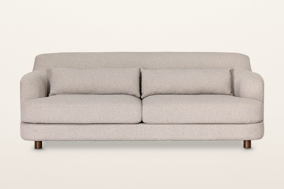 Ripatransone sofa in Beige, straight front view on a warm white studio backdrop: two seat cushions on a rounded base