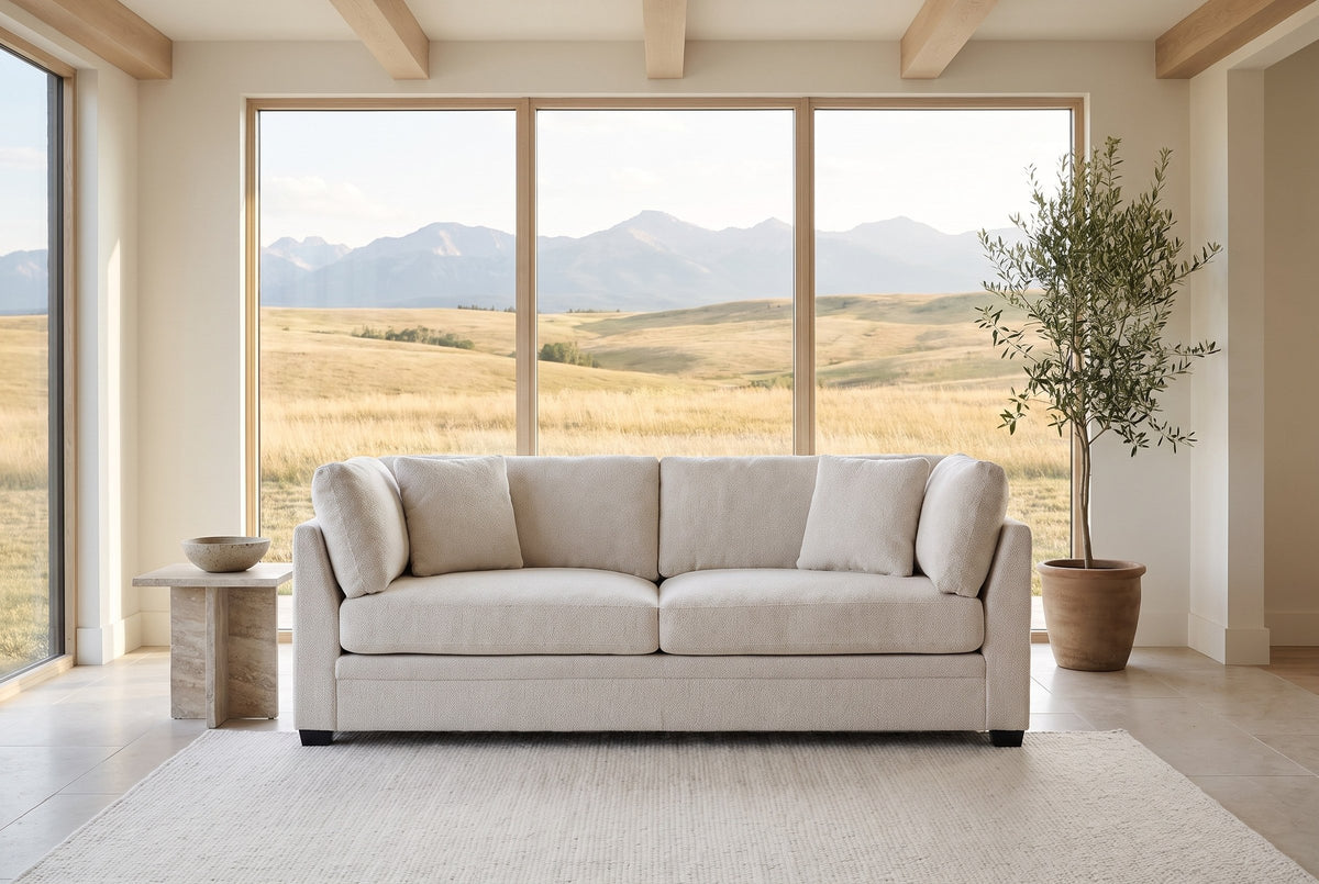 Rovigo sofa in a Calgary foothills great room with a window onto grassland and the Rocky Mountains