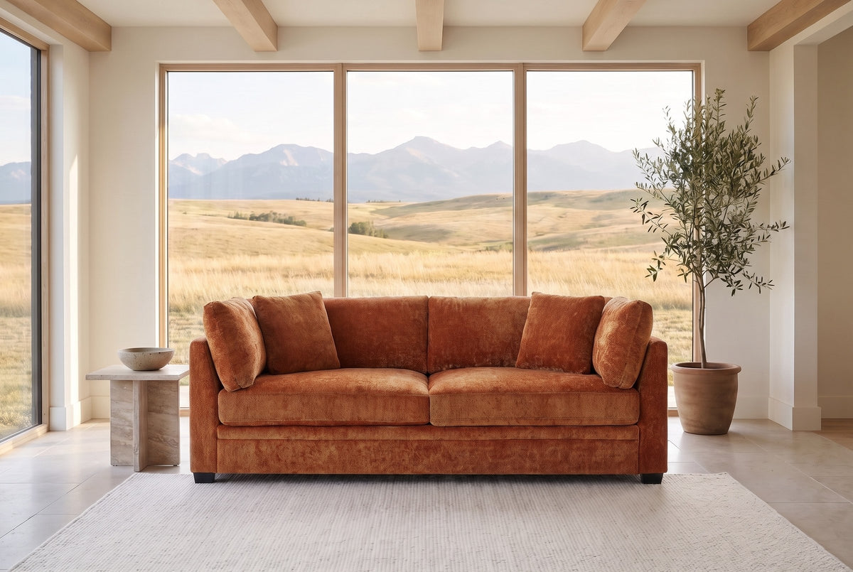 Rovigo sofa in caramel chenille in a Calgary foothills great room with a window onto grassland and the Rocky Mountains