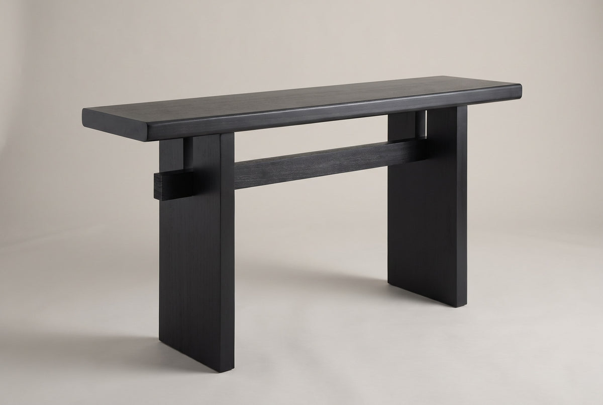 Sanremo slab-leg console table in black, three-quarter view on a warm grey studio backdrop