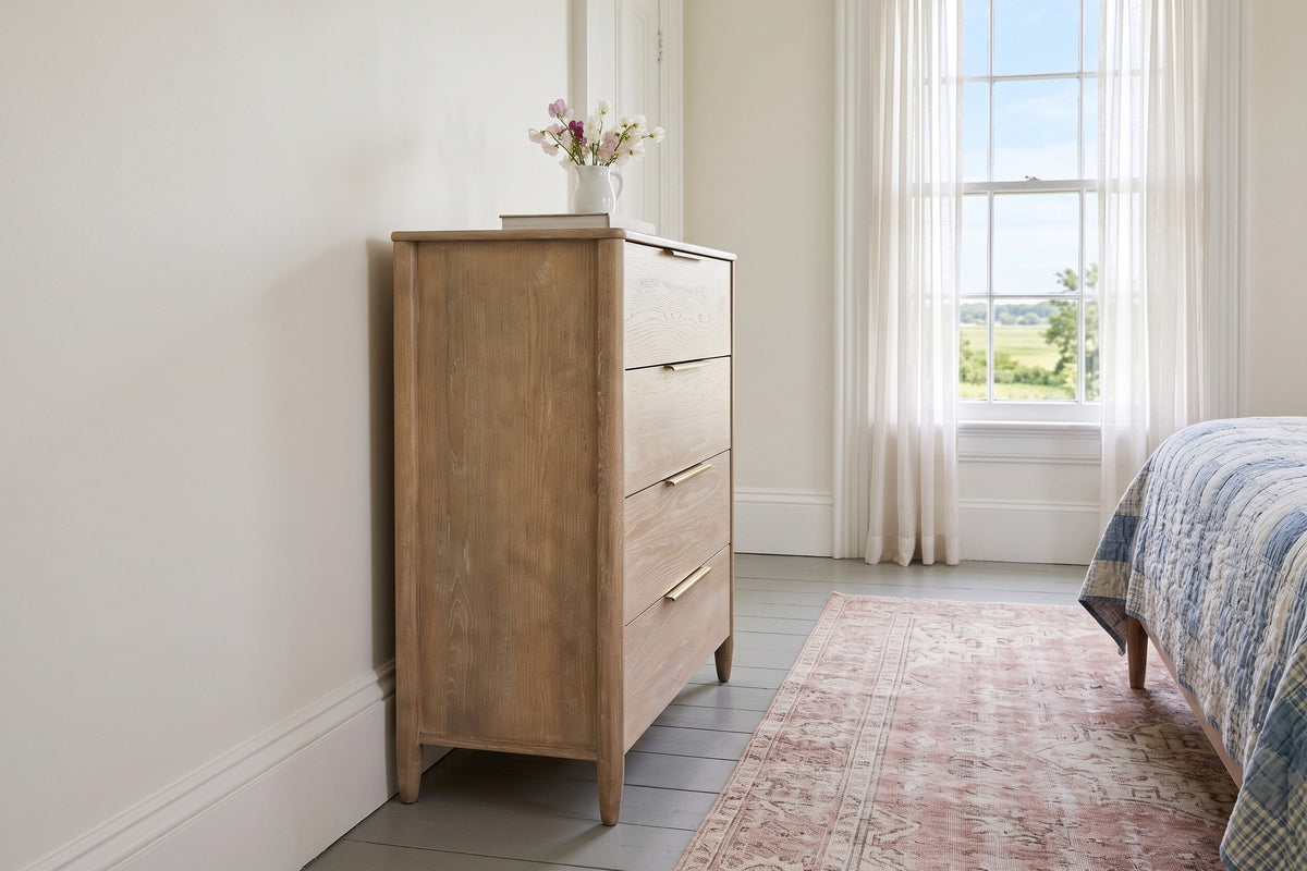 Side view of the Sarnano chest in Sand in a bedroom of a Victorian house in Sackville, New Brunswick, with warm white walls