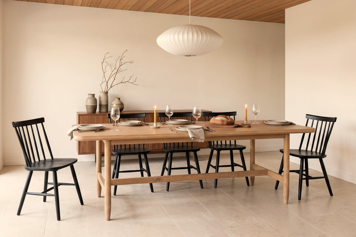 Sarnano dining table in Sand set for dinner in a West Vancouver dining room under a cedar ceiling