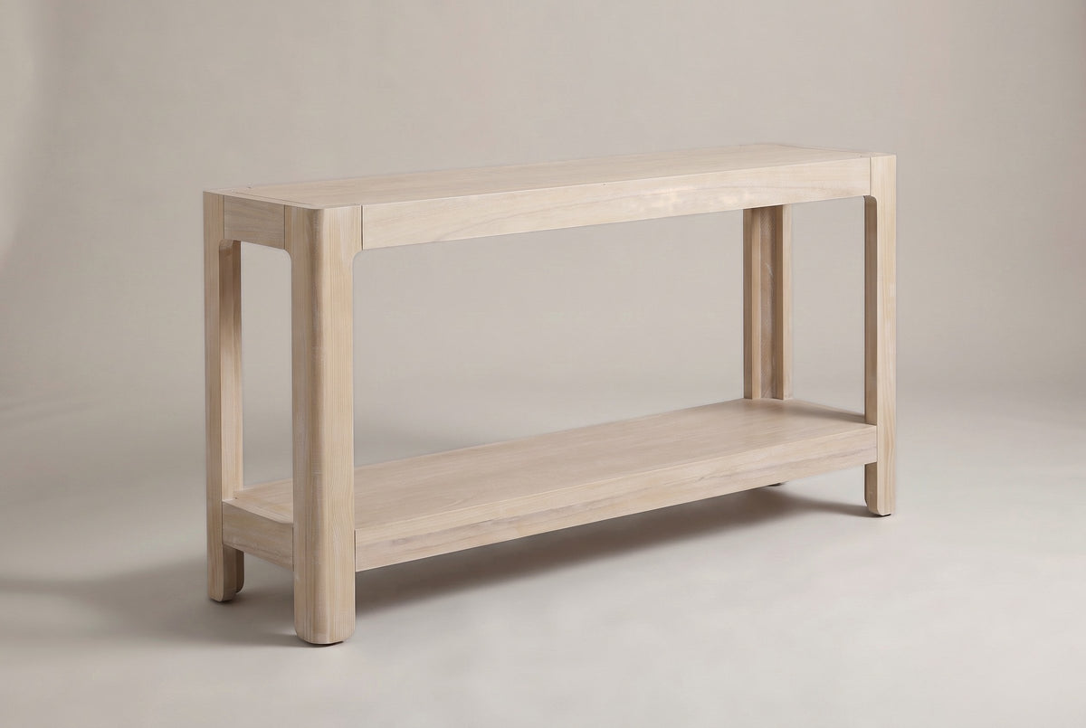 Sarnico farmhouse console table in the natural pine finish, three-quarter view on a warm grey studio backdrop
