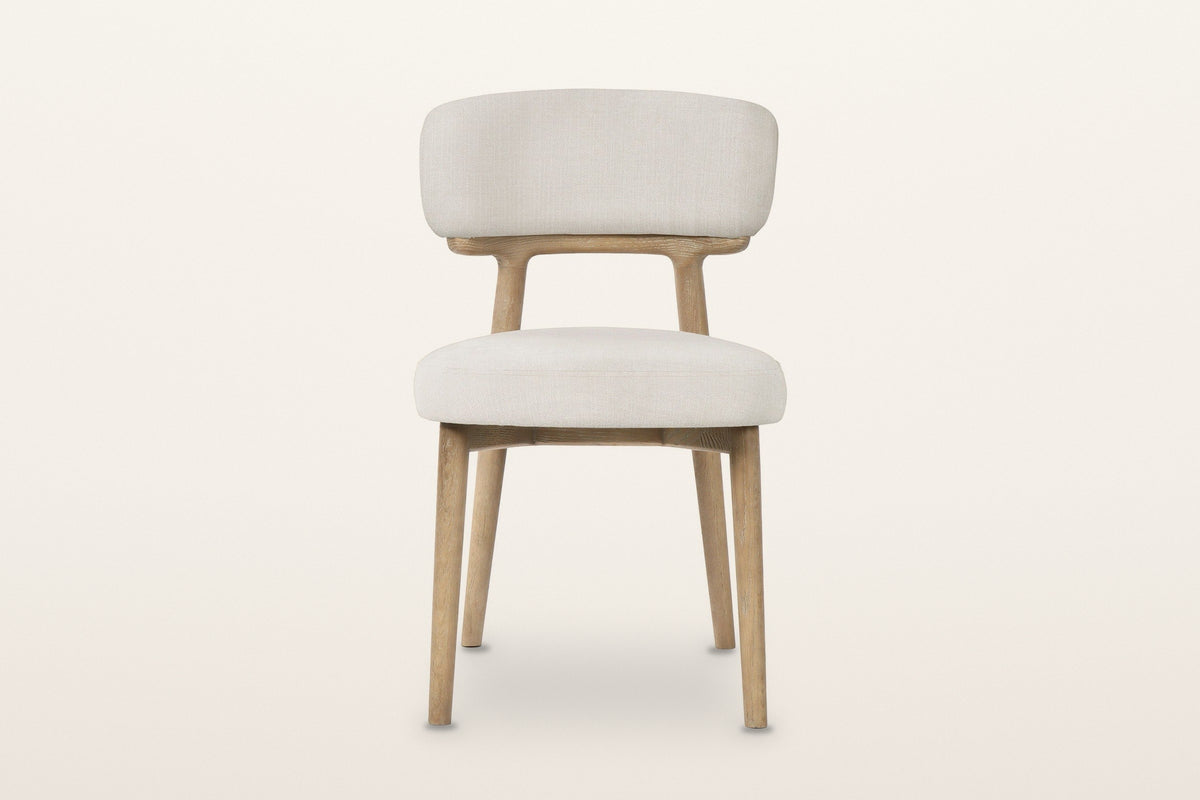 Savoca dining chair in Porcelain Chenille, front view on a warm white studio backdrop