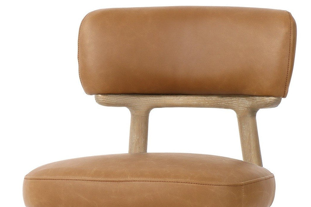 Close-up of the Savoca back band in Tawny leather on its curved ash yoke, above the stitched seat