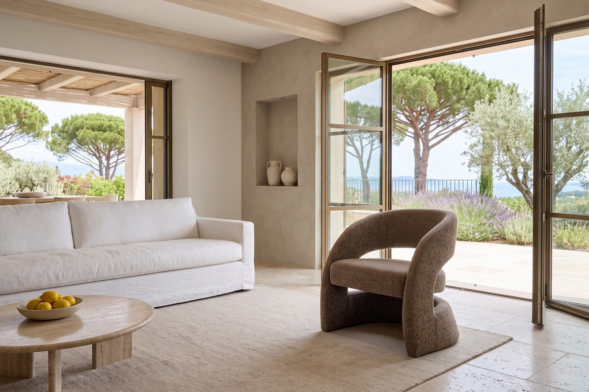 Sefro accent chair in Chocolate in a hillside villa in Ramatuelle, with plaster walls