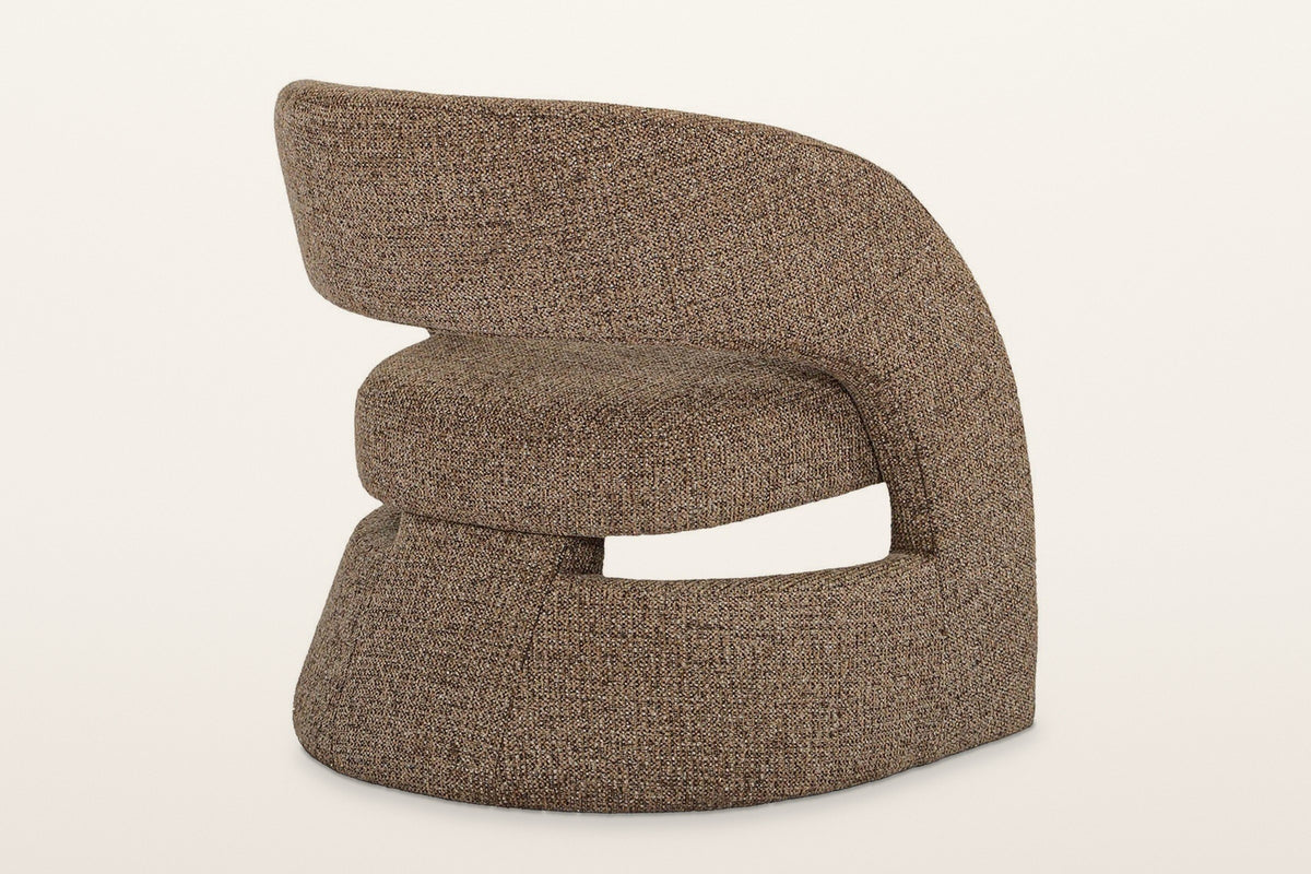 Sefro accent chair in Chocolate from the rear three-quarter on a warm white studio backdrop