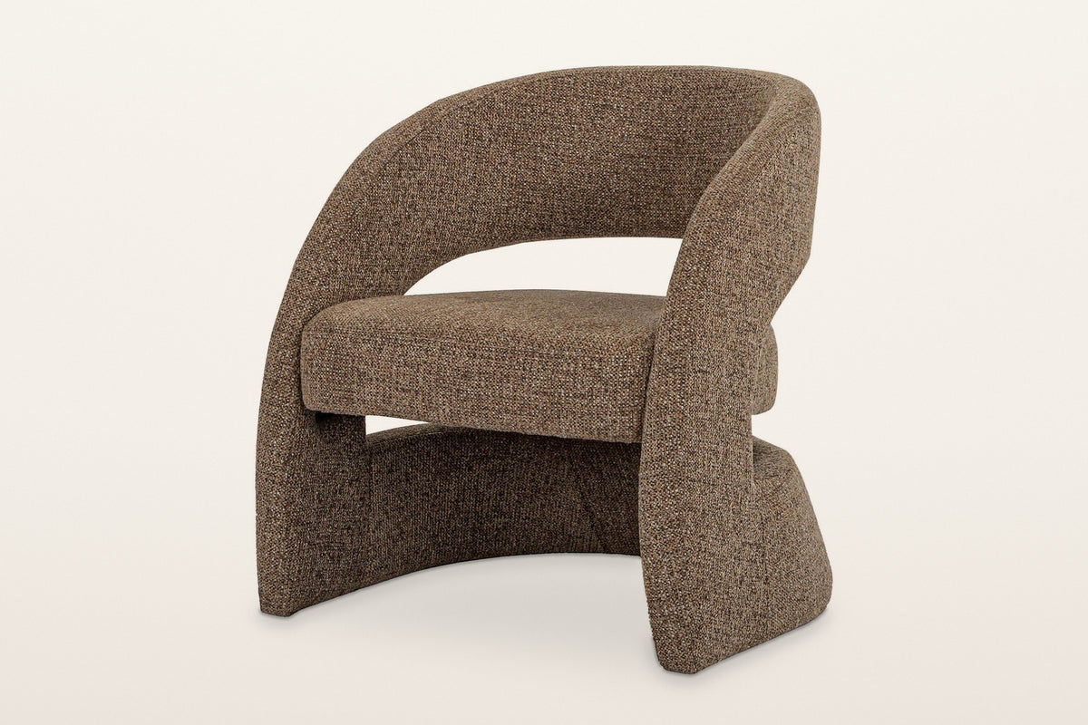 Sefro sculpted accent chair in Chocolate, three-quarter view on a warm white studio backdrop