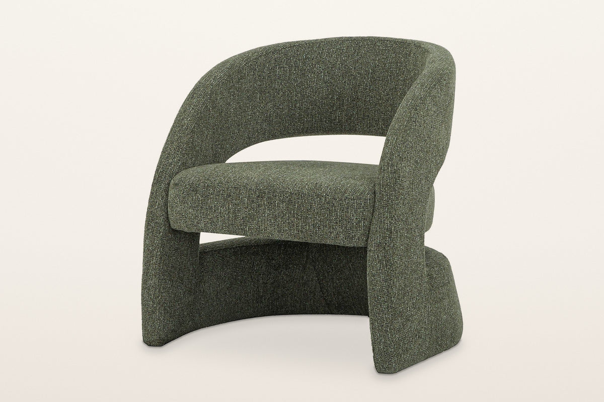 Sefro sculpted accent chair in Green, three-quarter view on a warm white studio backdrop: two side panels sweeping up into