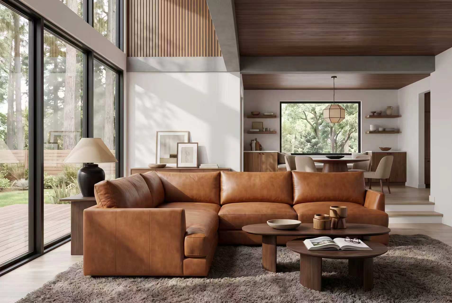 Serena leather corner sectional in Cognac beside floor-to-ceiling windows