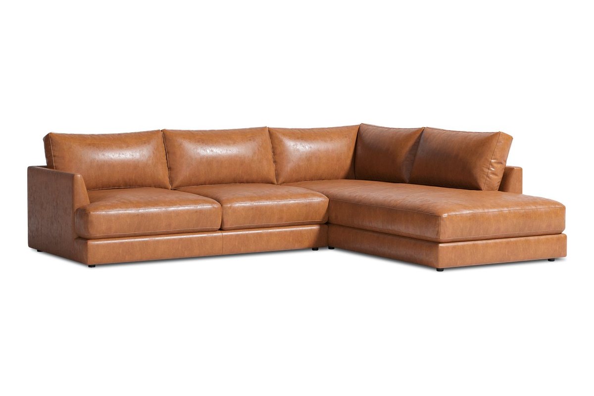 Serena bumper sectional in Cognac, three-quarter view, with overall width, depth and height, seat height, seat depth, back height, seat width, chaise length and chaise width marked