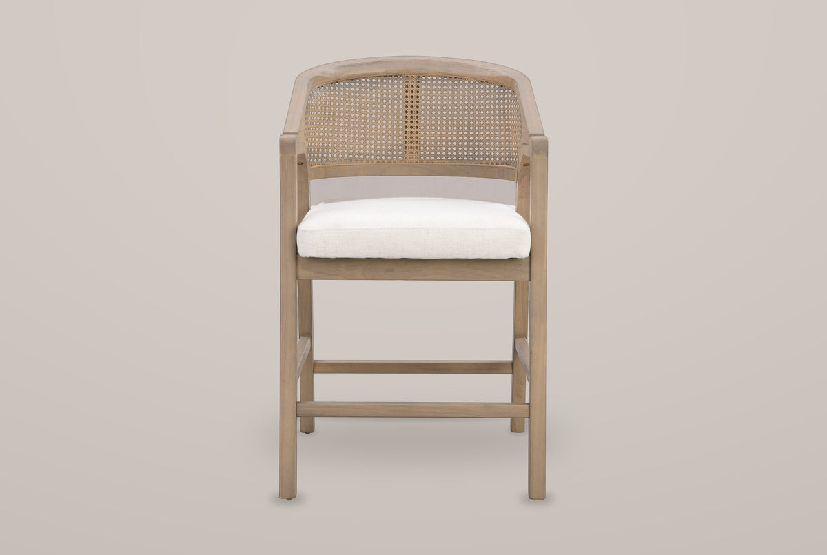 Sermoneta counter stool in Natural Ash, straight front view showing the tub back, the cane-look panel