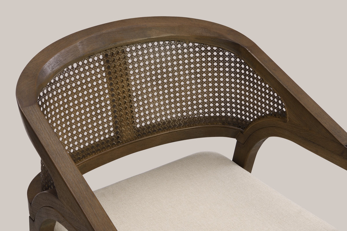 Close-up of the wide curved top rail, the cane-look weave panel with its denser centre strip