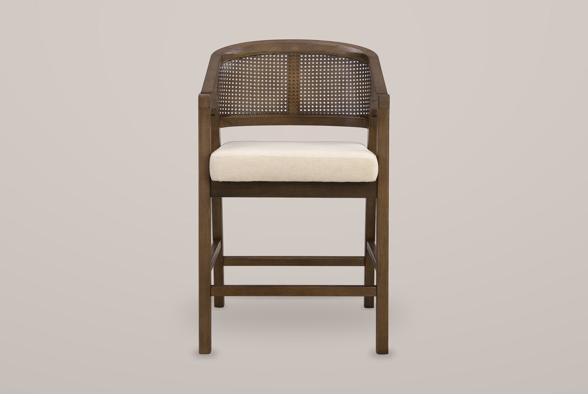 Sermoneta counter stool in Walnut, straight front view showing the tub back, the cane-look panel