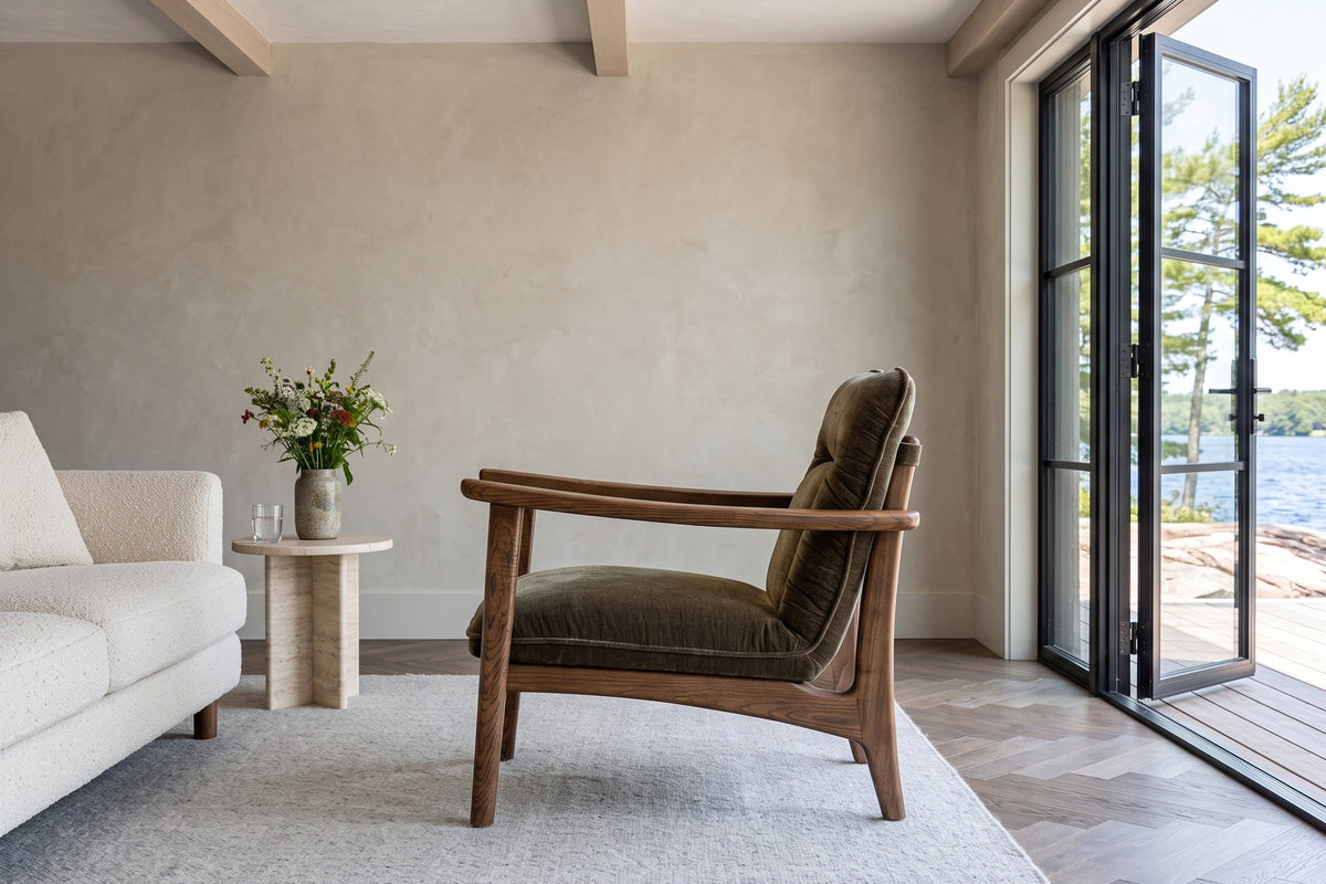 Servigliano accent chair in Green in side profile in a Rosseau lake house in Muskoka