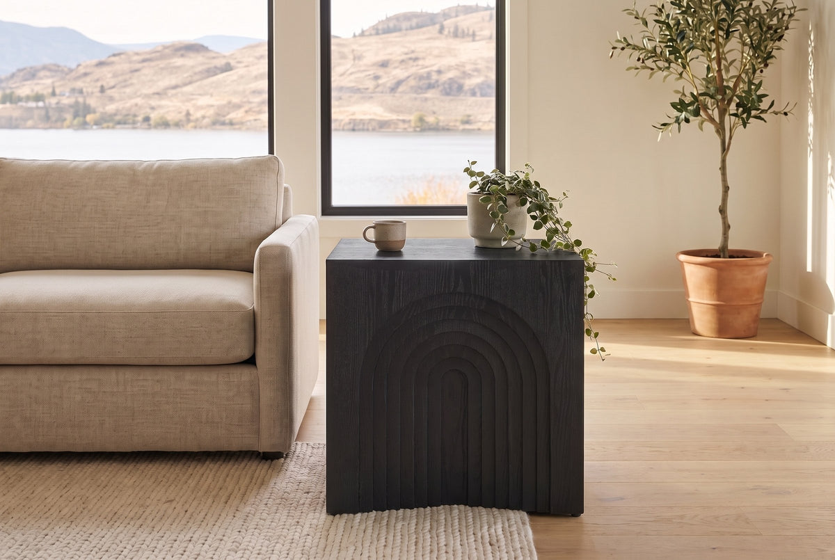 Sondrio side table in Black beside a linen sofa in a bright Kelowna lake house living room