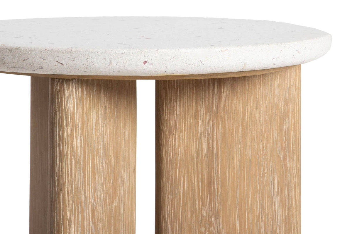 Close-up of the Sorano top: seashell terrazzo with pale pink and mauve flecks, a rounded edge, and the limed oak slabs below