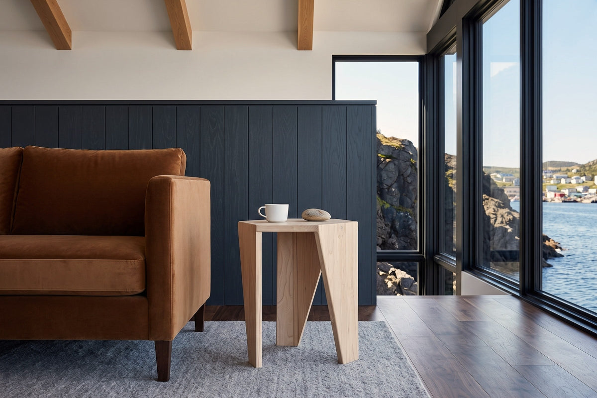 Side view of the Sovana side table in Sandblast White Elm at the arm of a tobacco velvet sofa in a Petty Harbour house