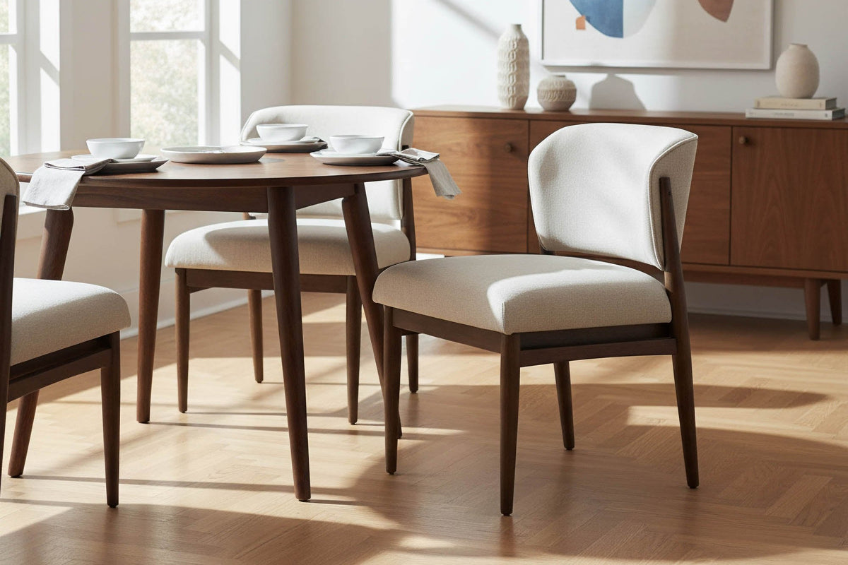 Sutton linen taupe dining chairs at a round table in a sunlit room