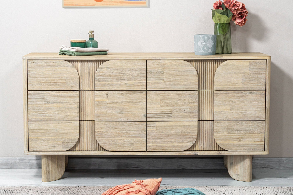Sylvan dresser styled with flowers and books beside floor cushions