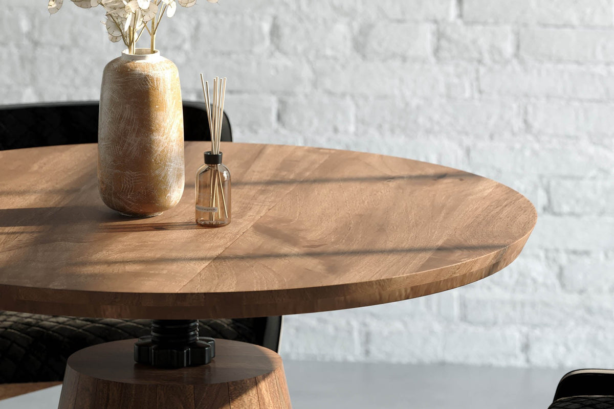 Thorne acacia tabletop with a ceramic vase and the iron column below