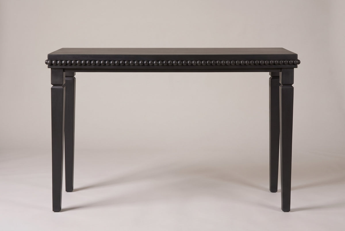 Treviso console table in Black, straight front view: a row of round wooden beads under the top, four square stepped legs