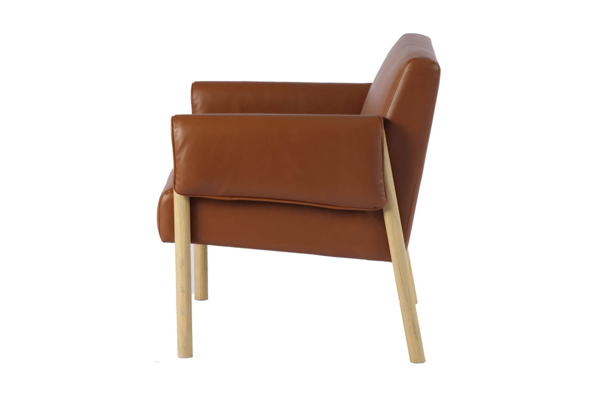 Upton saddle faux leather accent chair, side view of the wrapped arm