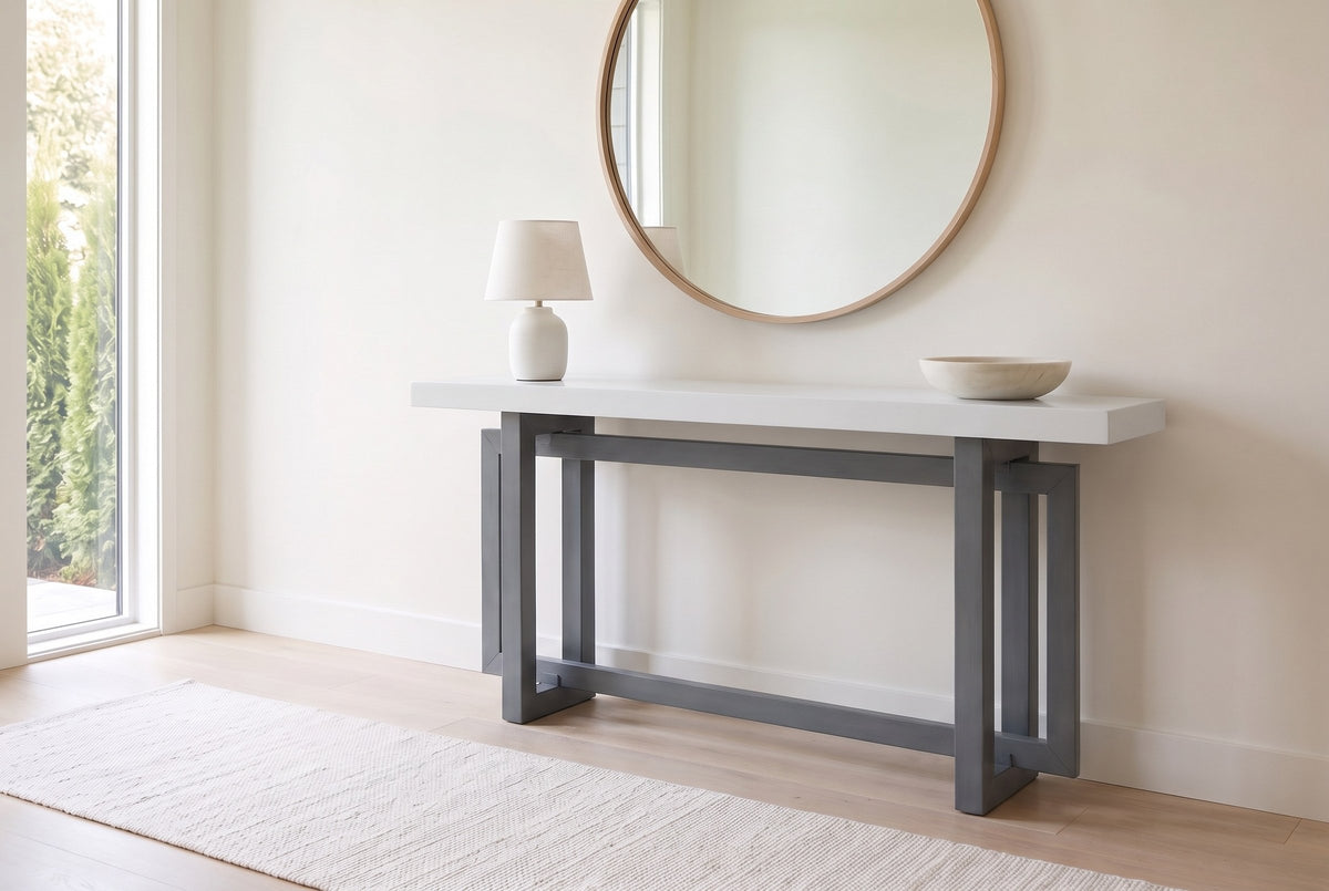 Urbania console table in Dark Gray + White in a bright entry under a round oak mirror, a white lamp and a stone bowl on top