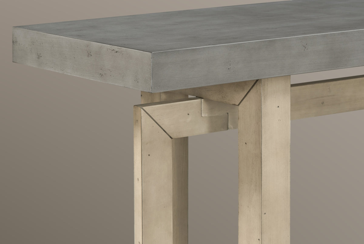 Close-up of the joint where the light pine-tone end frame, the long frame and the front post meet under the gray top