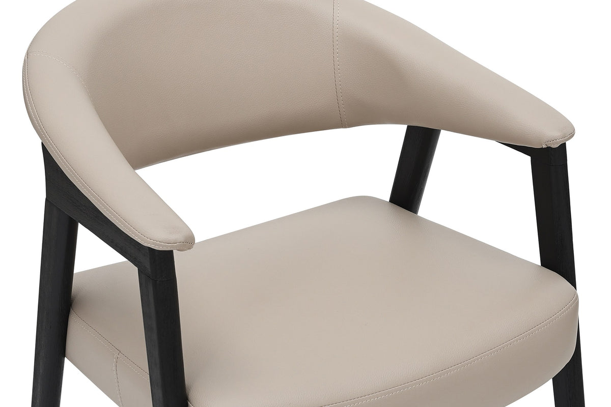 Vance dining armchair close-up of the wraparound faux leather back and cushioned seat
