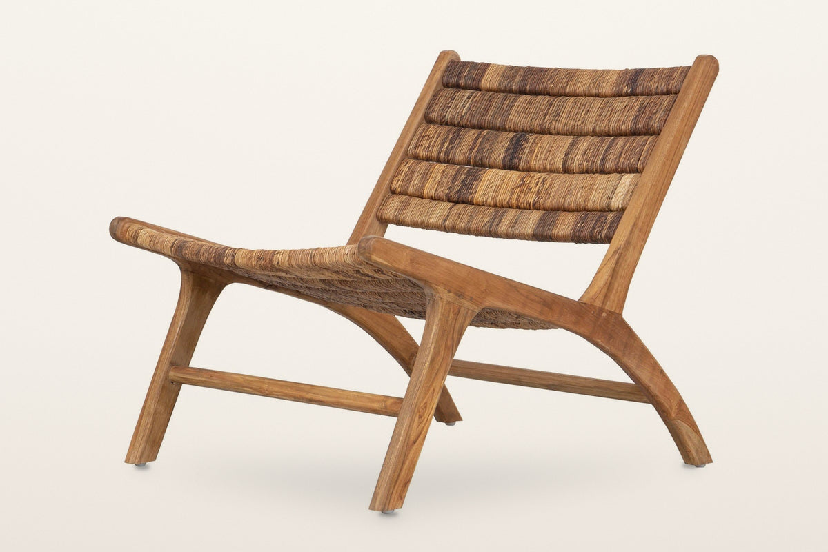 Varigotti reclaimed teak and abaca accent chair, three-quarter view on a warm white studio backdrop: a low armless frame