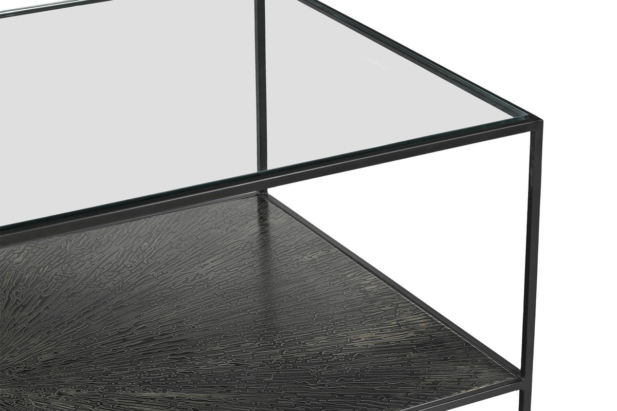 Vaughn coffee table corner showing the glass top, iron frame and textured lower shelf