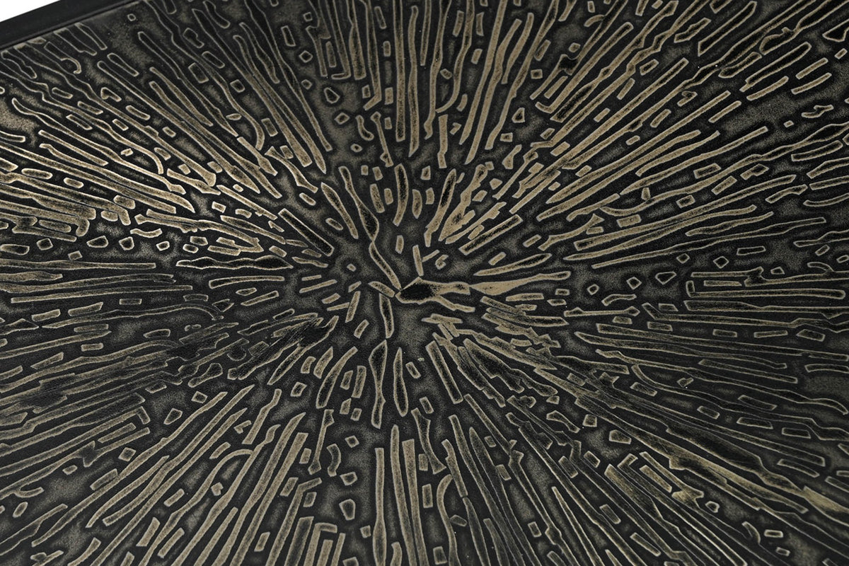 Close-up of the Vaughn console's raised radiating shelf pattern with warm metallic highlights