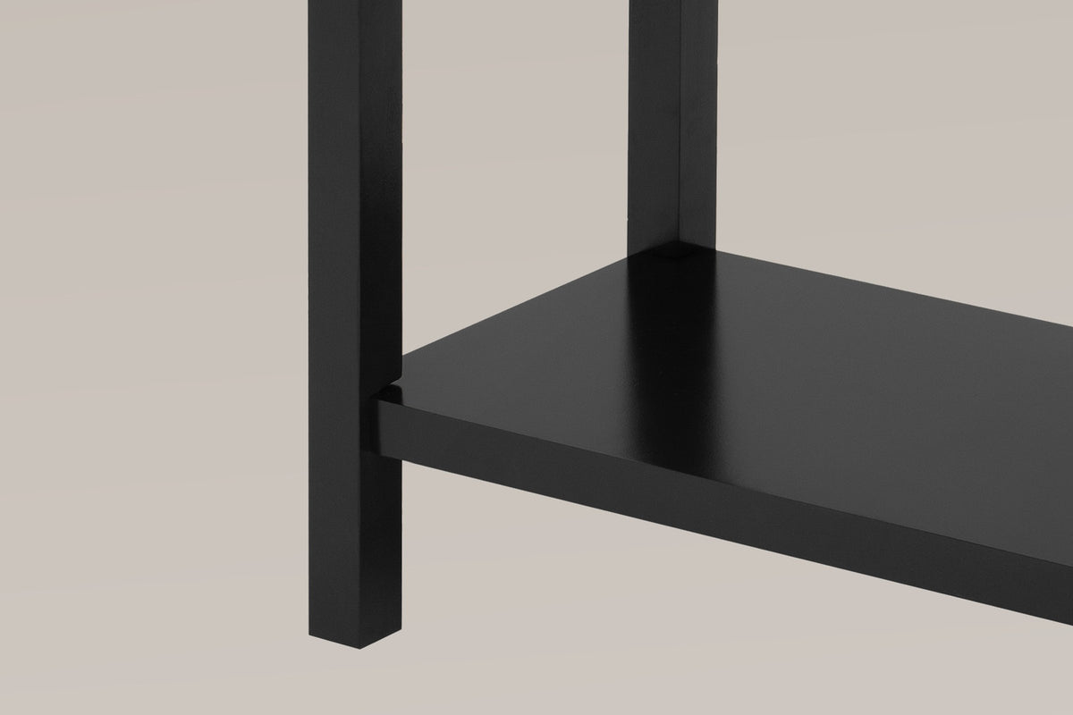 Close-up of a black square leg and the lower shelf meeting it