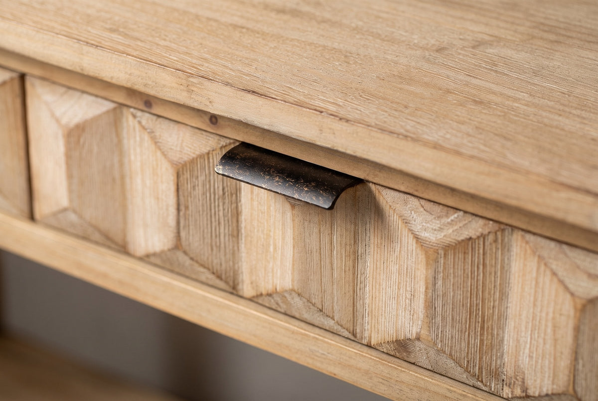 Close-up of a honeycomb-carved fir drawer front with its distressed iron lip pull on the top edge