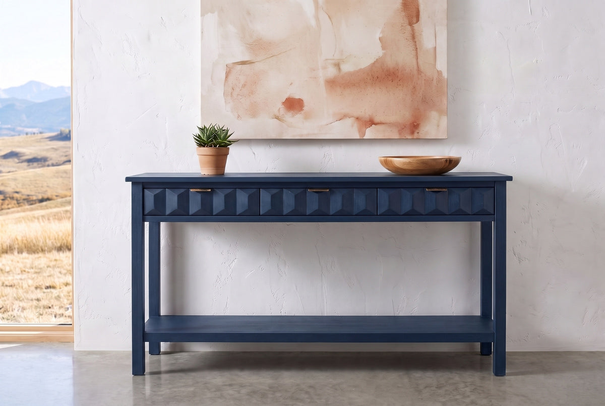 Navy blue Velletri console table against a white plaster wall in a Calgary foothills house