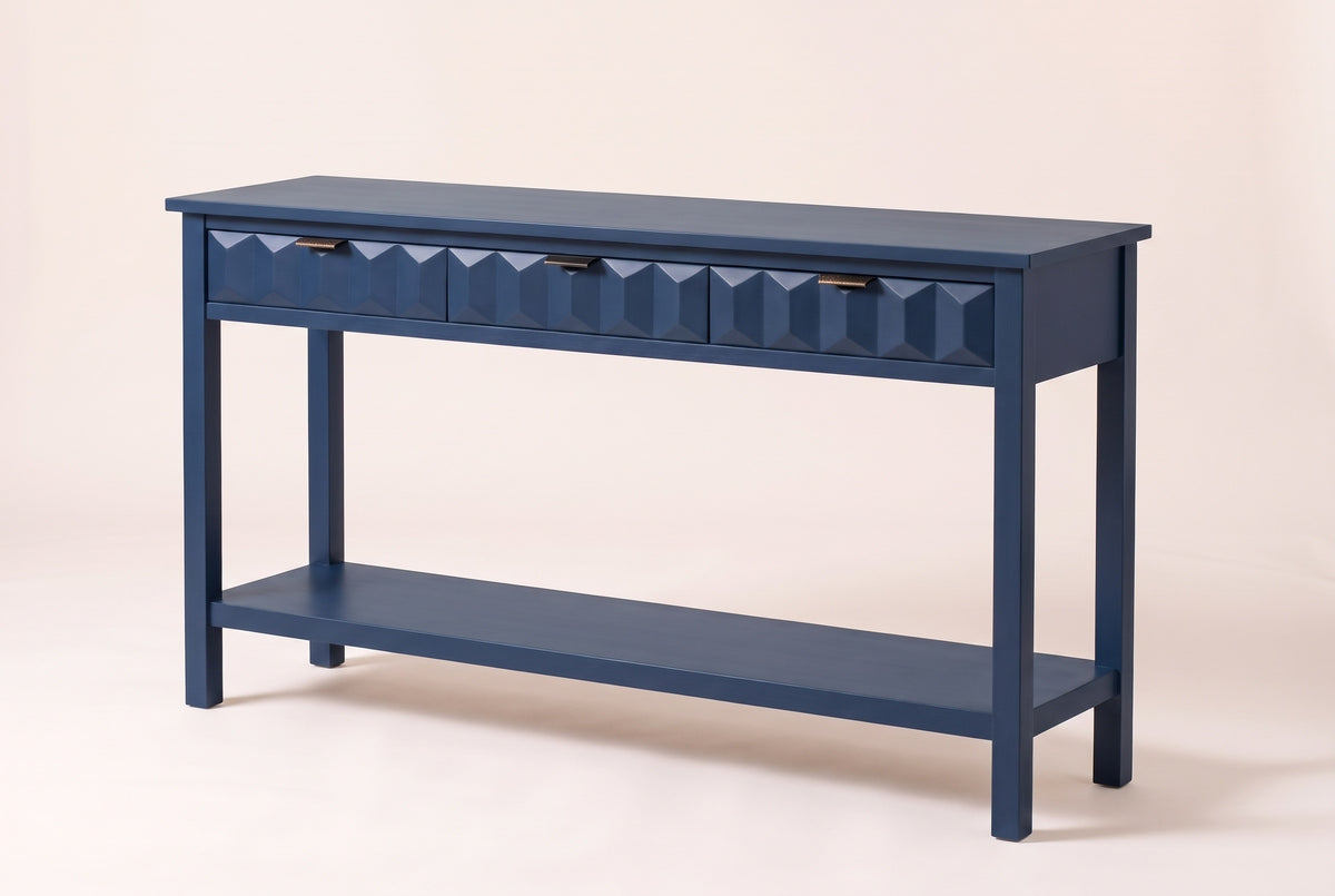 Velletri 3-drawer console table in navy blue, three-quarter view on a warm off-white backdrop