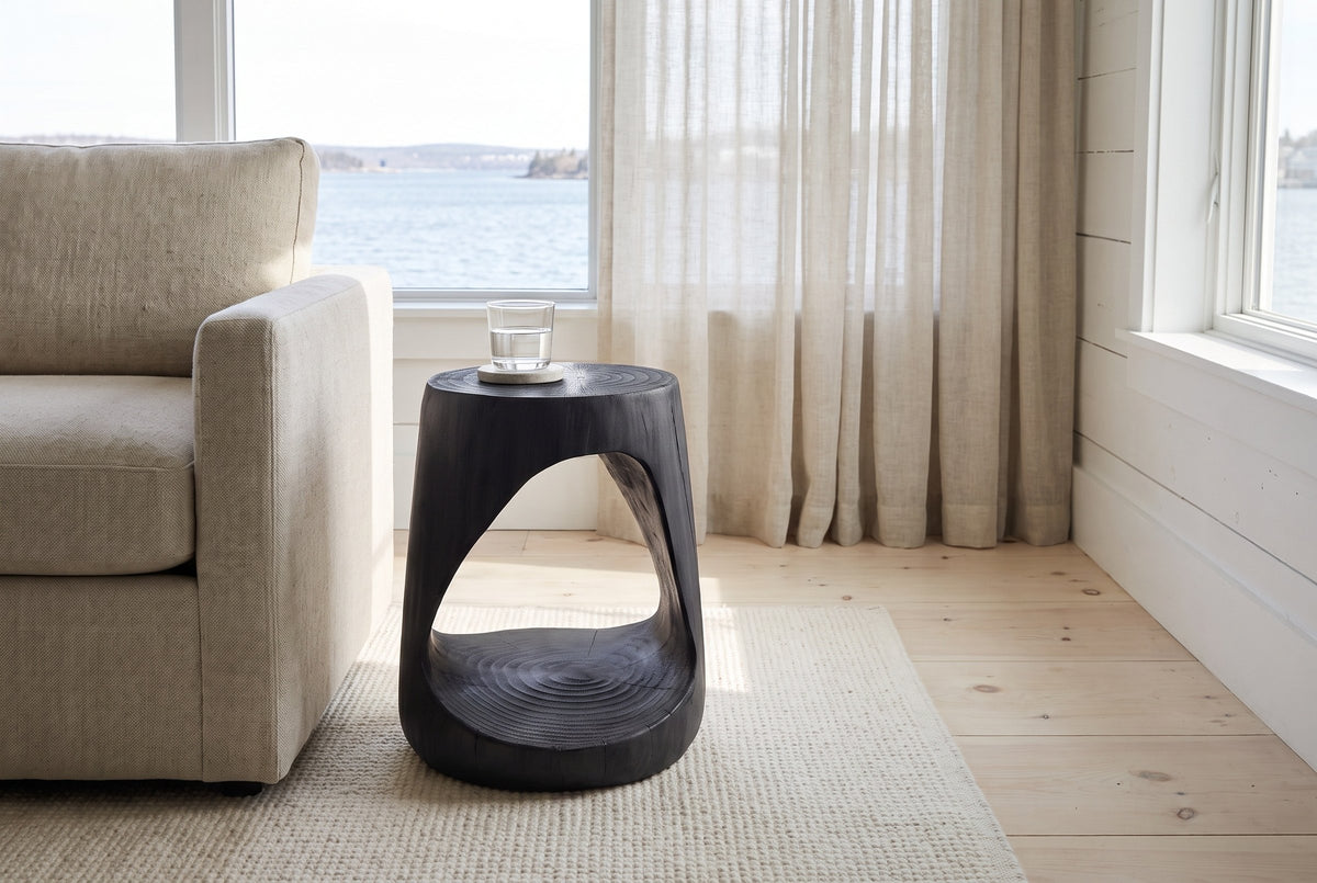 Venzone side table in Black beside a linen sofa in a bright Halifax living room with a harbour view