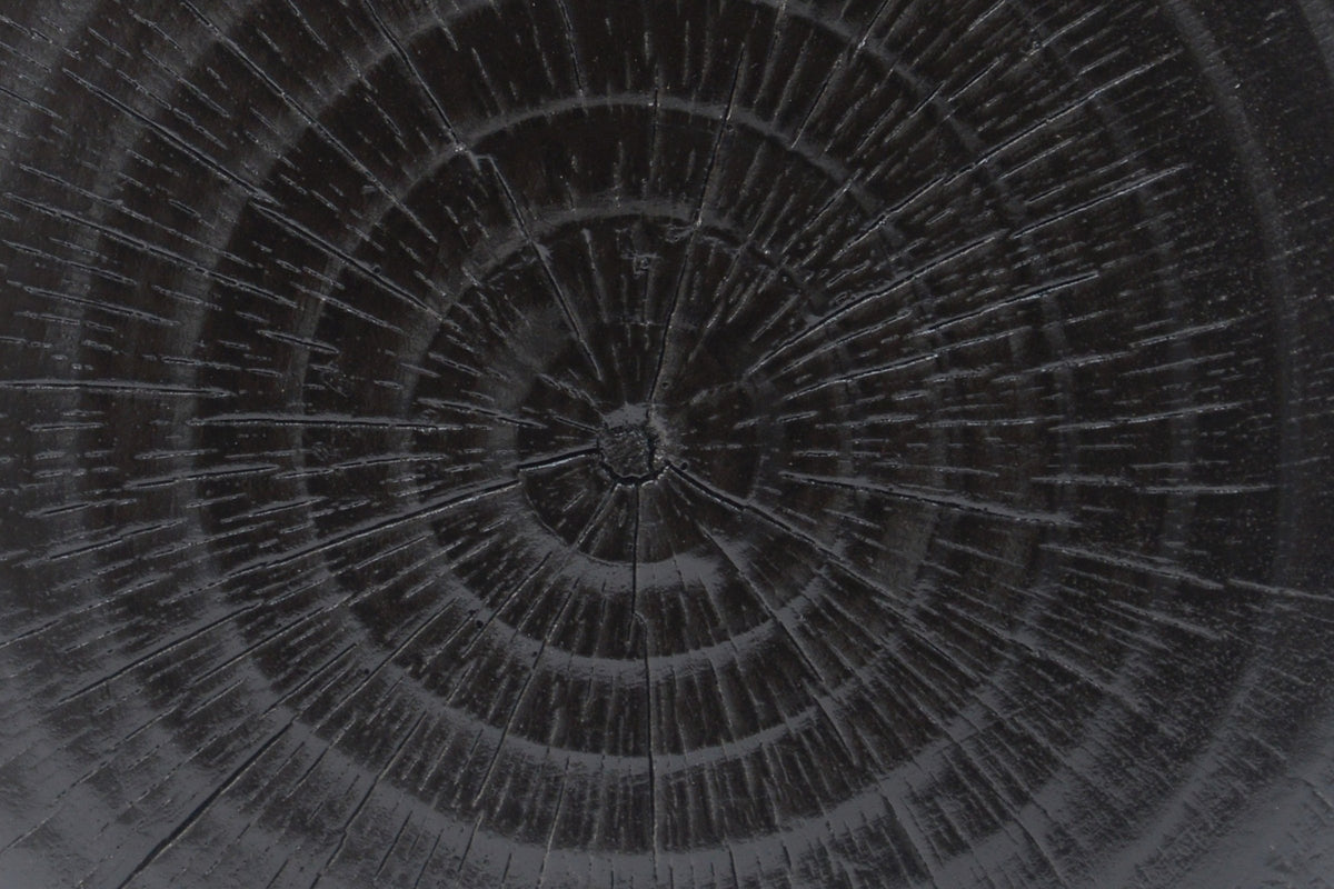 Close-up of the Black Venzone top: moulded rings and fine radial checks in the cast surface