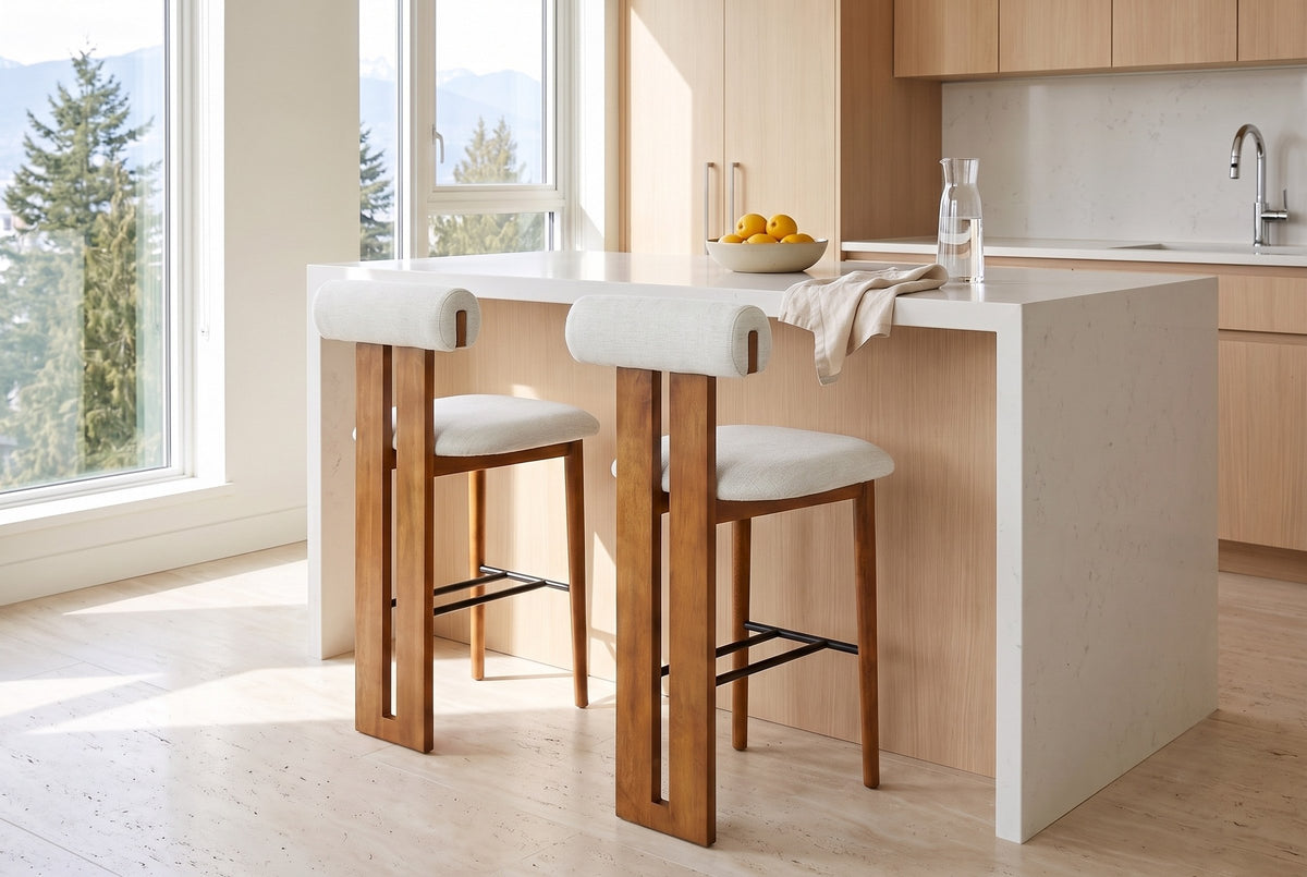 Two Vigoleno bar stools in Ivory at a white quartz island in a bright Vancouver kitchen with pale oak cabinets and a bowl
