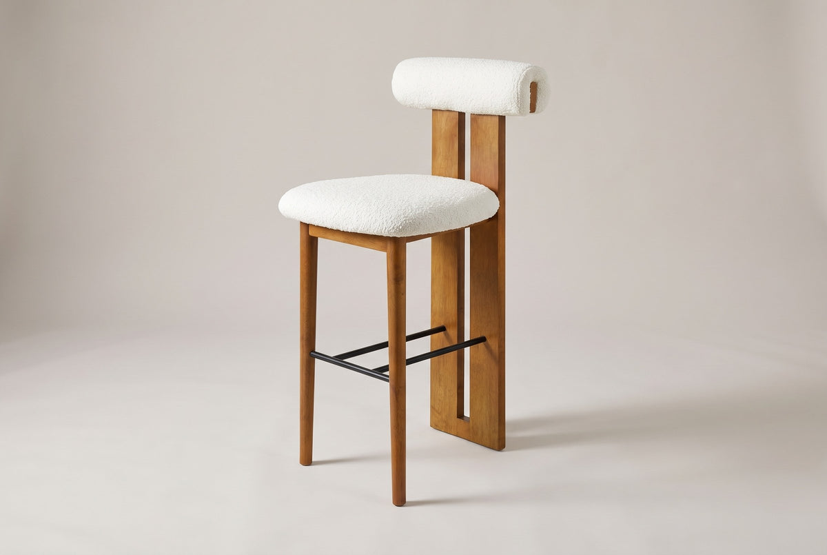 Vigoleno bar stool in White, three-quarter view on a warm grey studio backdrop
