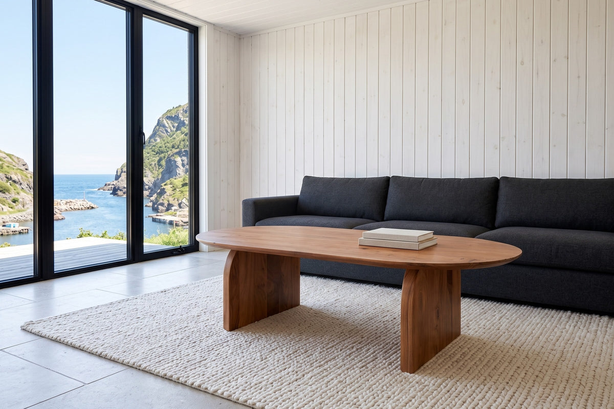 Visso coffee table in Pecan seen low from the corner in a Quidi Vidi harbour house, with whitewashed pine boards